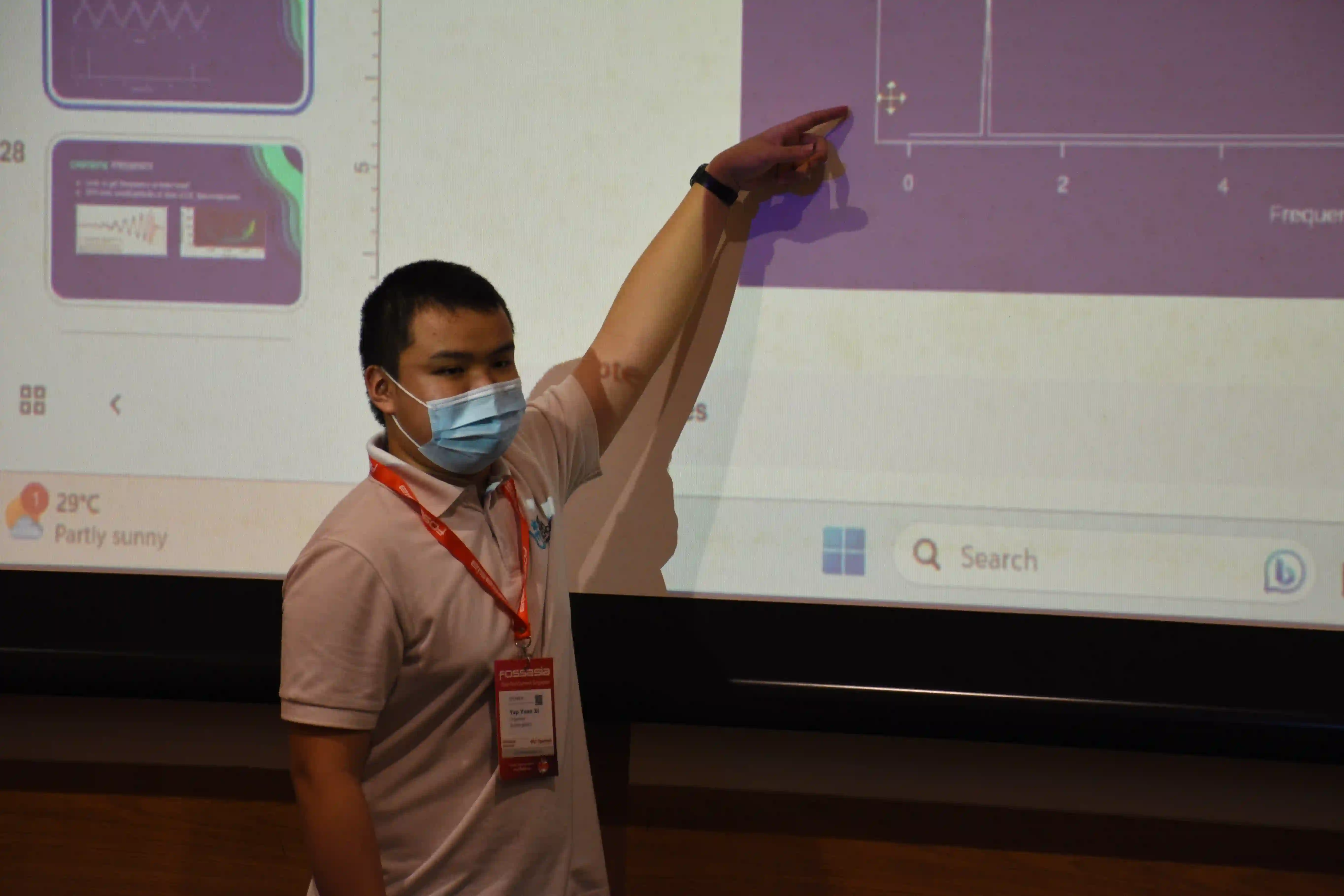An organiser speaking at a FOSSASIA event